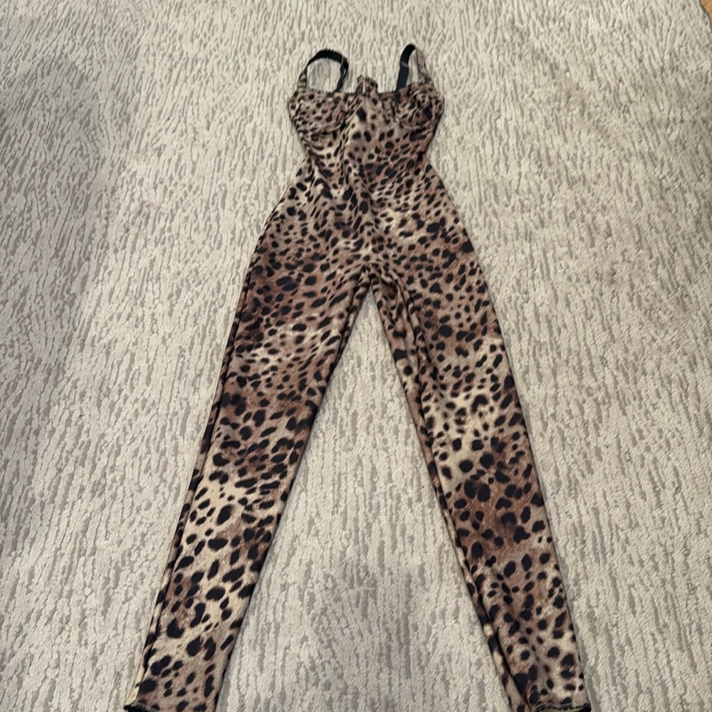 Skims dolce and Gabana cat suit size small. Never worn but did remove the tags.